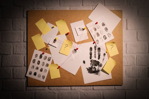 Papers connected with threads on a board